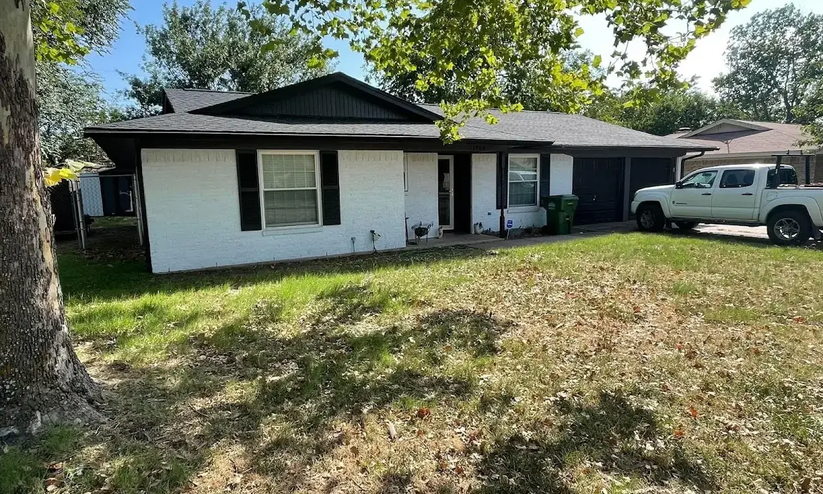 Professional roofing crew working on a residential roof in Seagoville